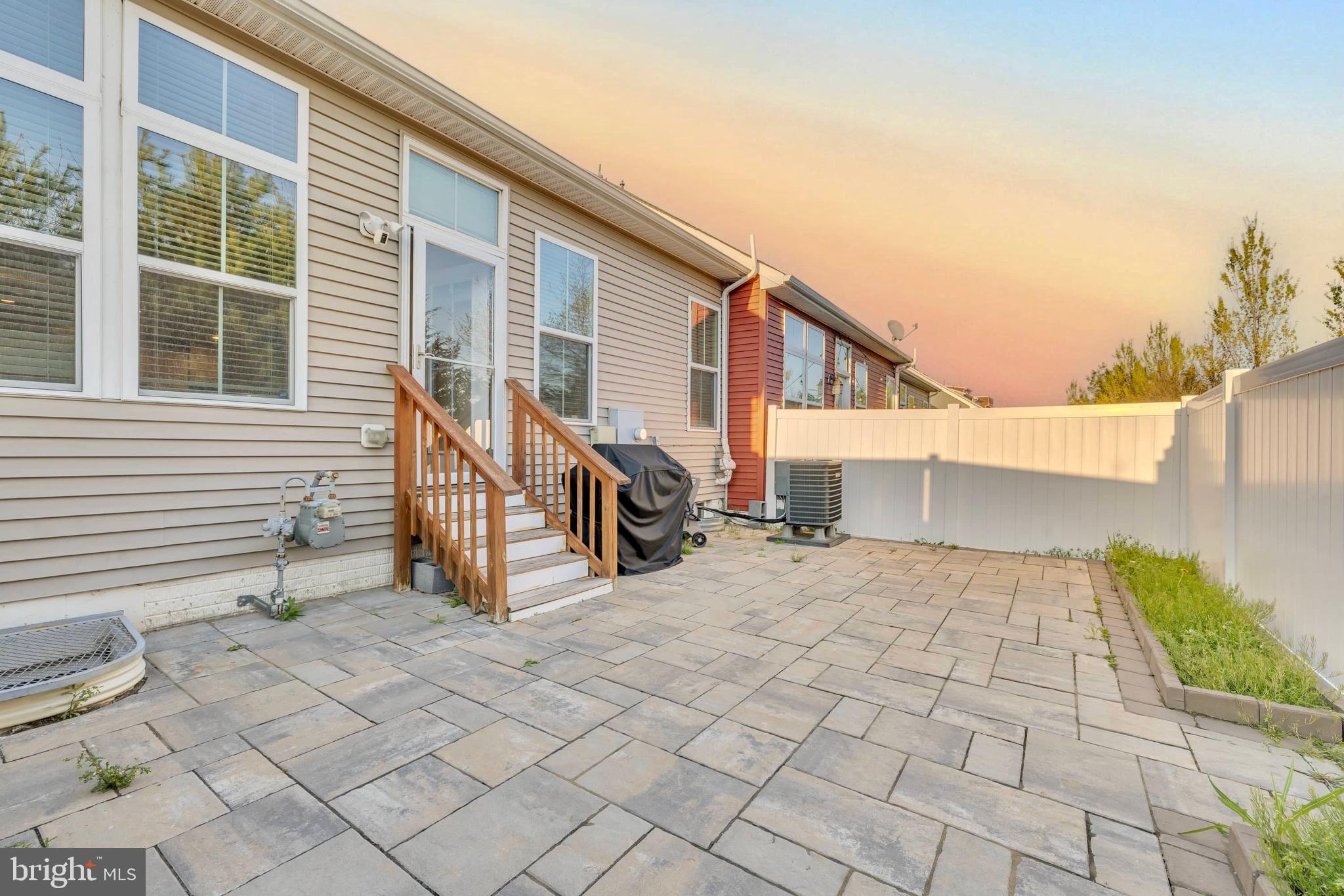 41663 McMonagle Square Aldie, VA 20105 - Photo 25 of 50 a view of a house with backyard and sitting area