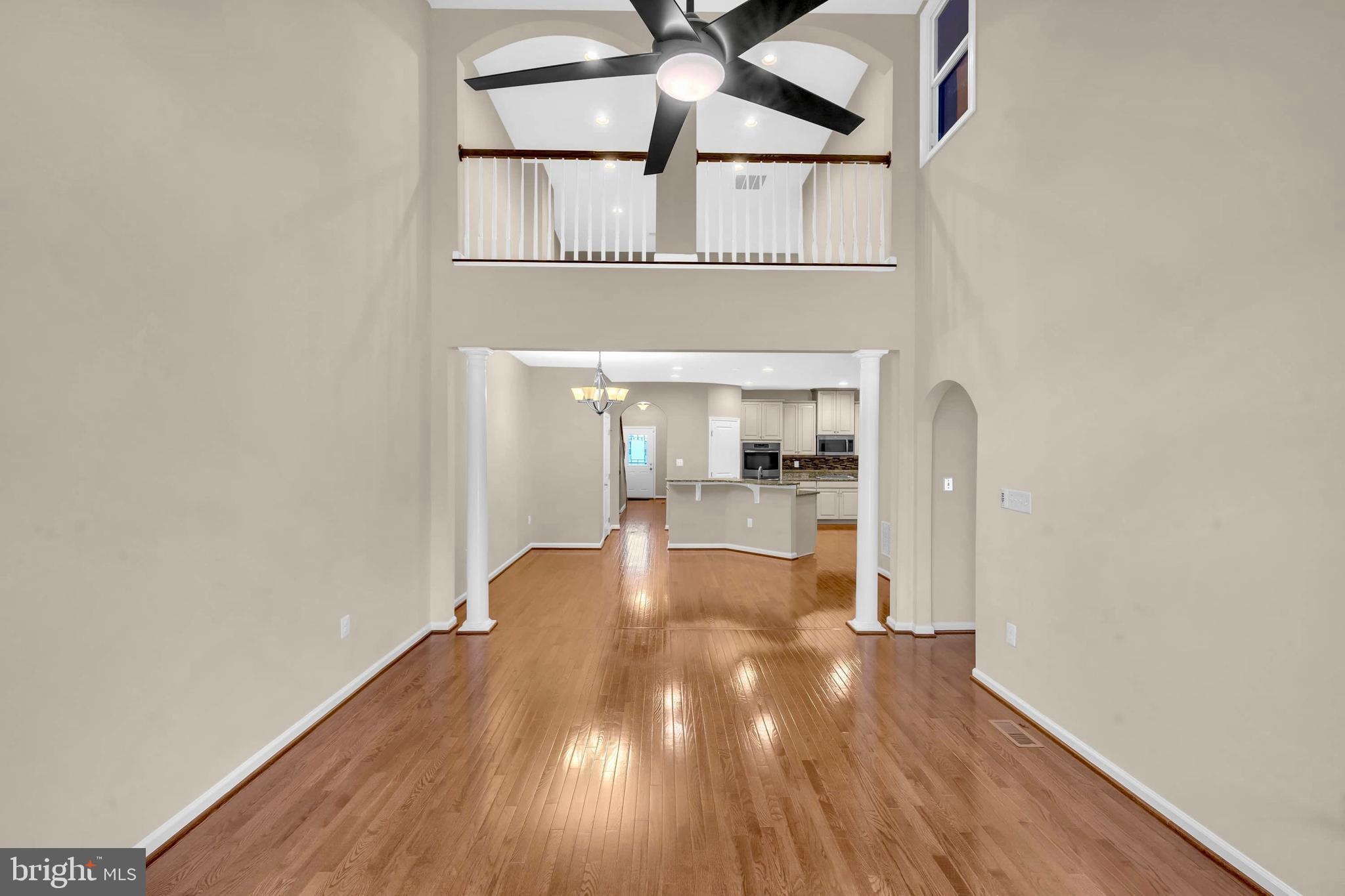 41663 McMonagle Square Aldie, VA 20105 - Photo 26 of 50 a view of a kitchen with wooden floor and a fireplace