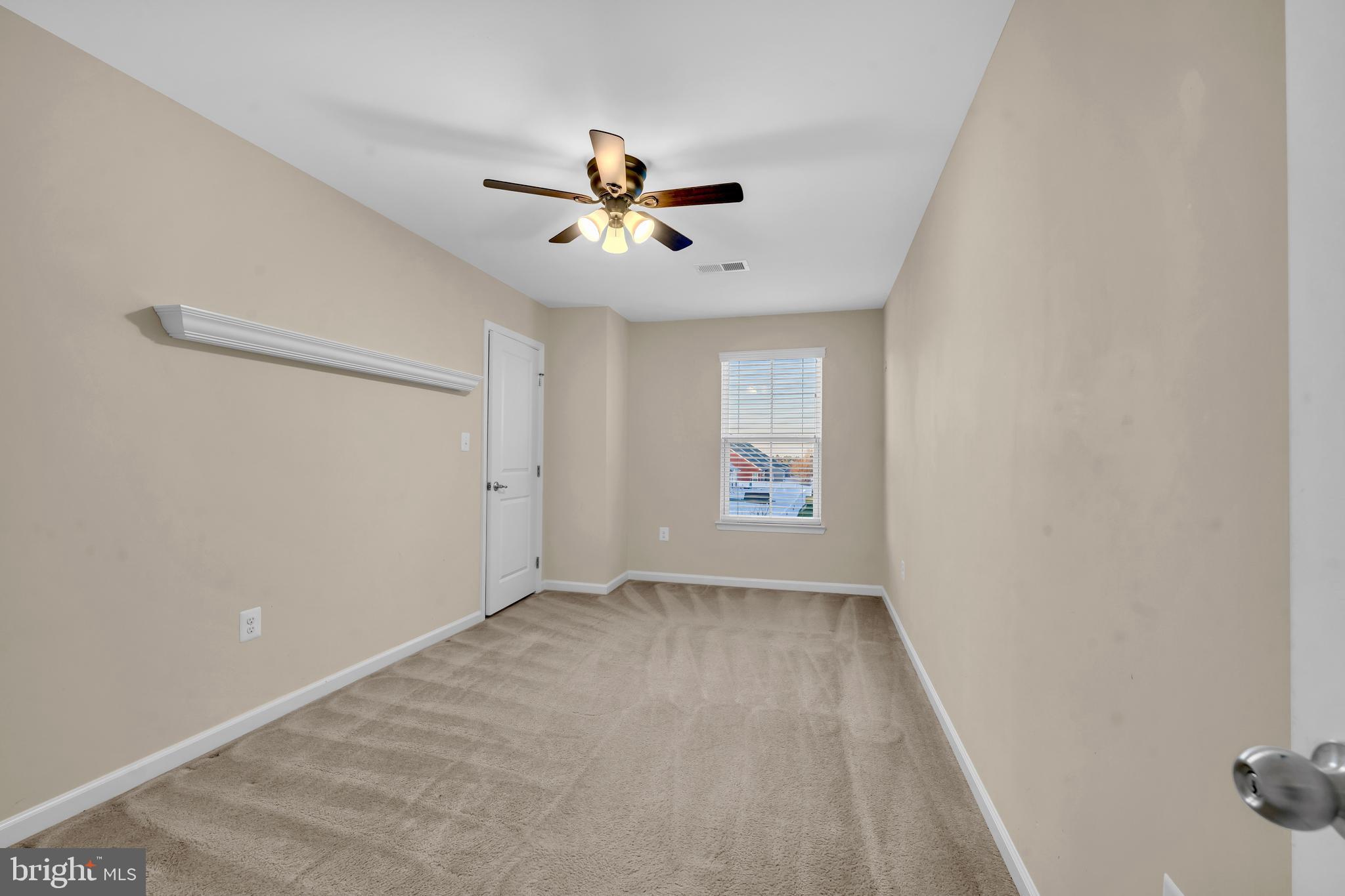 41663 McMonagle Square Aldie, VA 20105 - Photo 33 of 50 an empty room with windows and fan