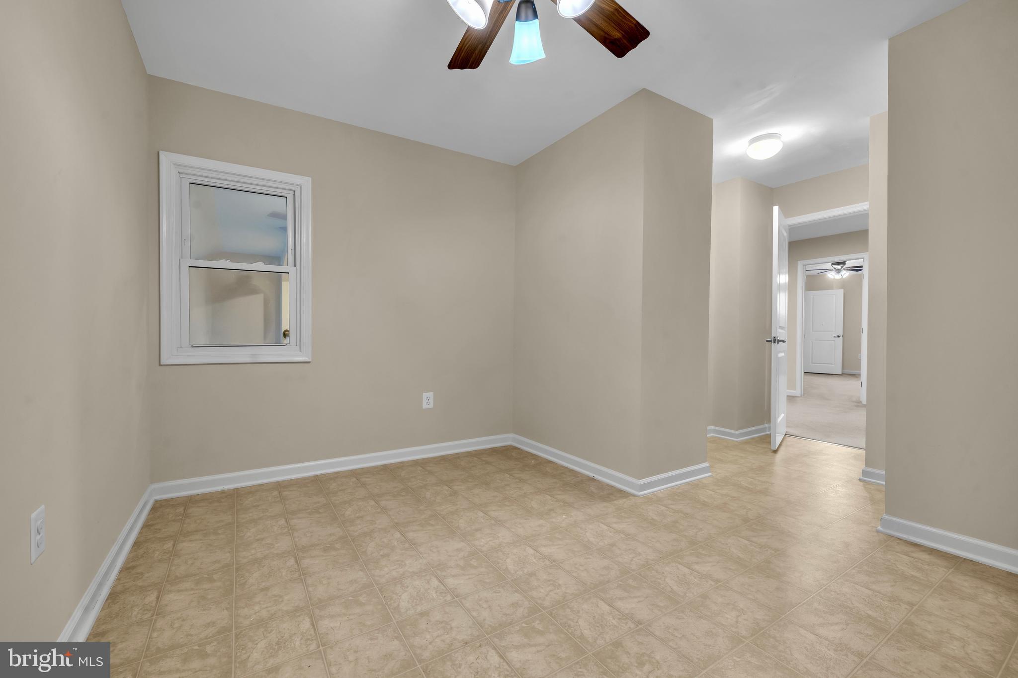 41663 McMonagle Square Aldie, VA 20105 - Photo 37 of 50 an empty room with chandelier fan and windows