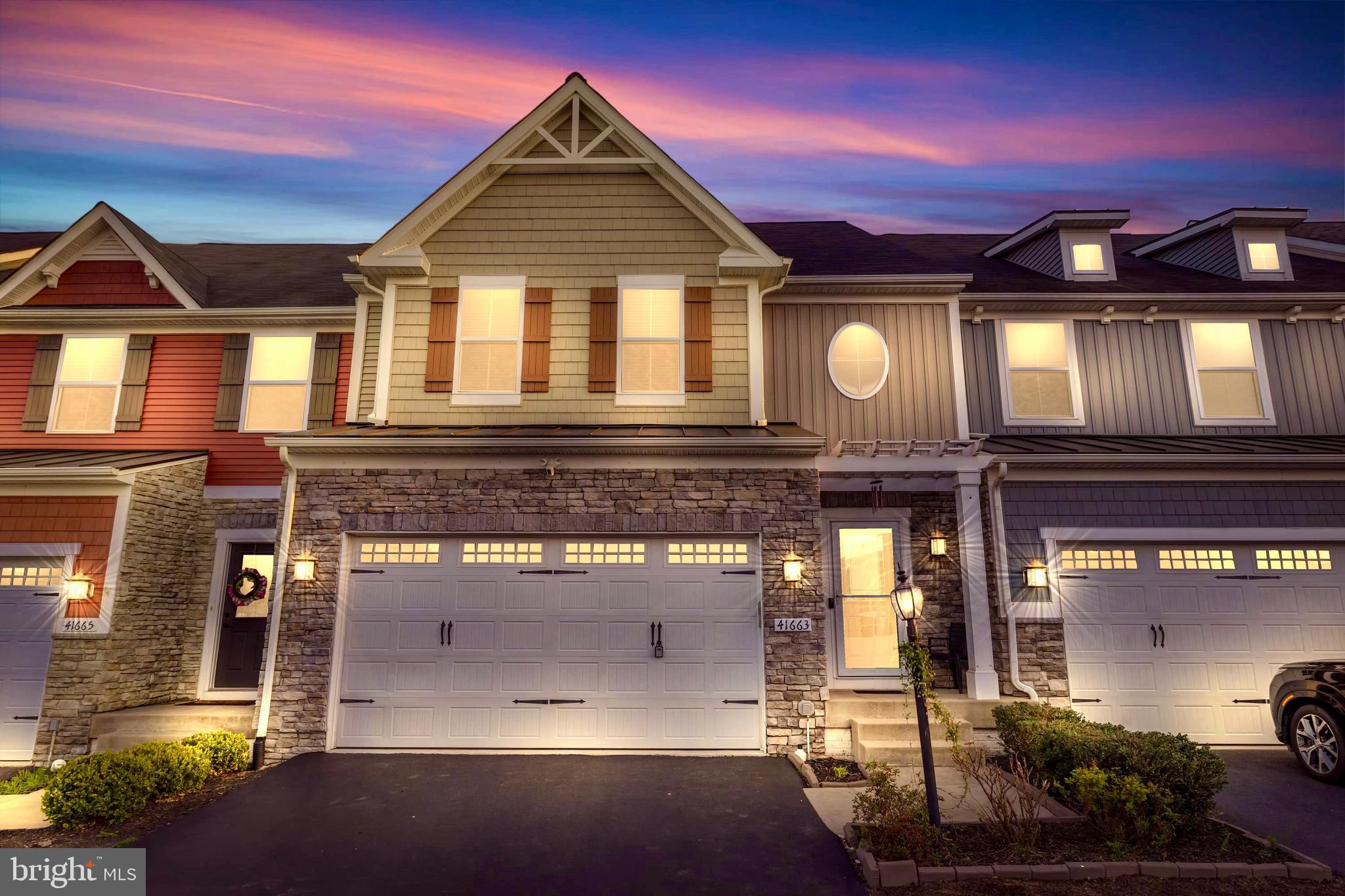 41663 McMonagle Square Aldie, VA 20105 - Photo 39 of 50 a large building with a clock on the wall