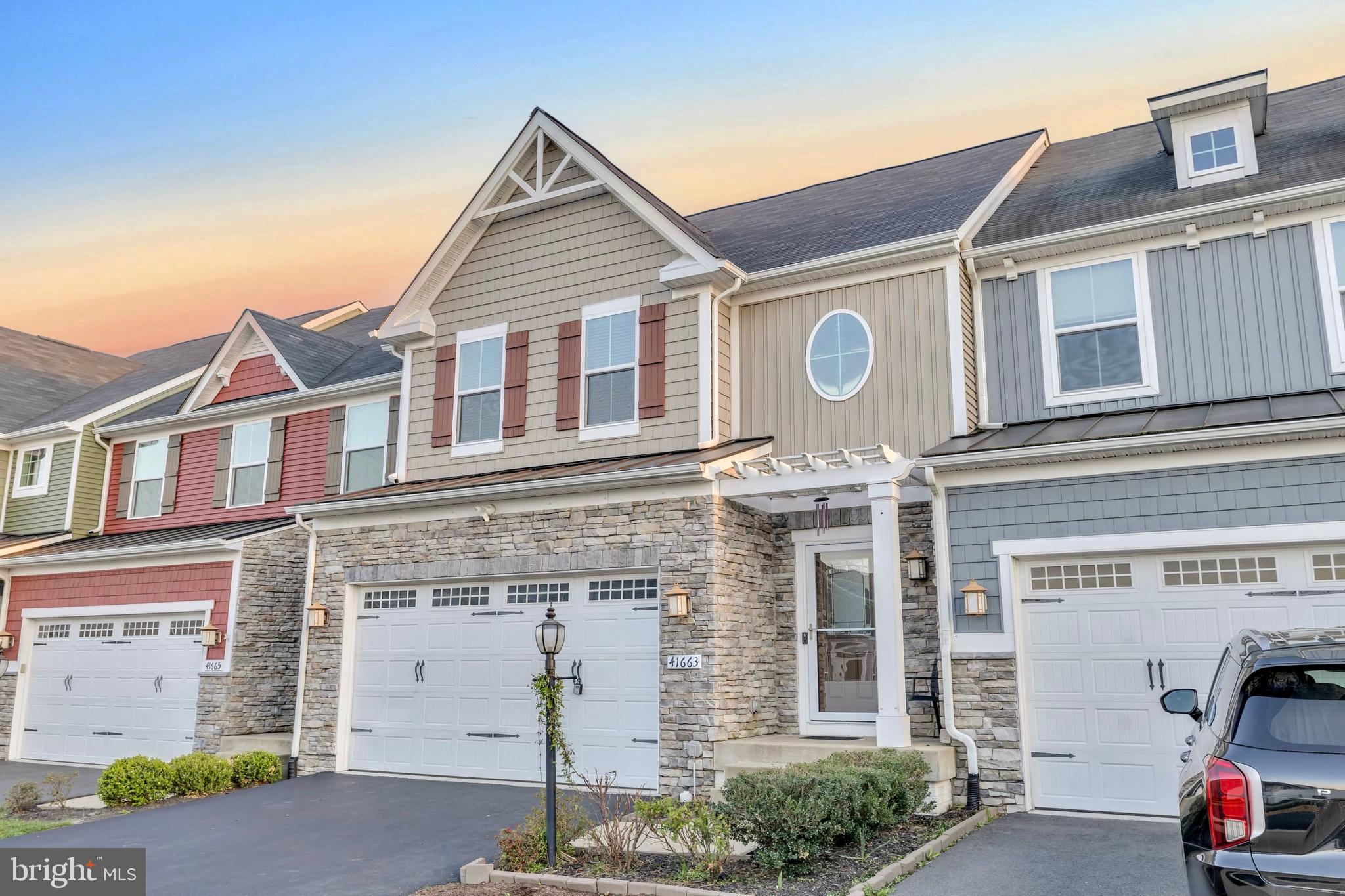 41663 McMonagle Square Aldie, VA 20105 - Photo 41 of 50 a front view of a house with parking space