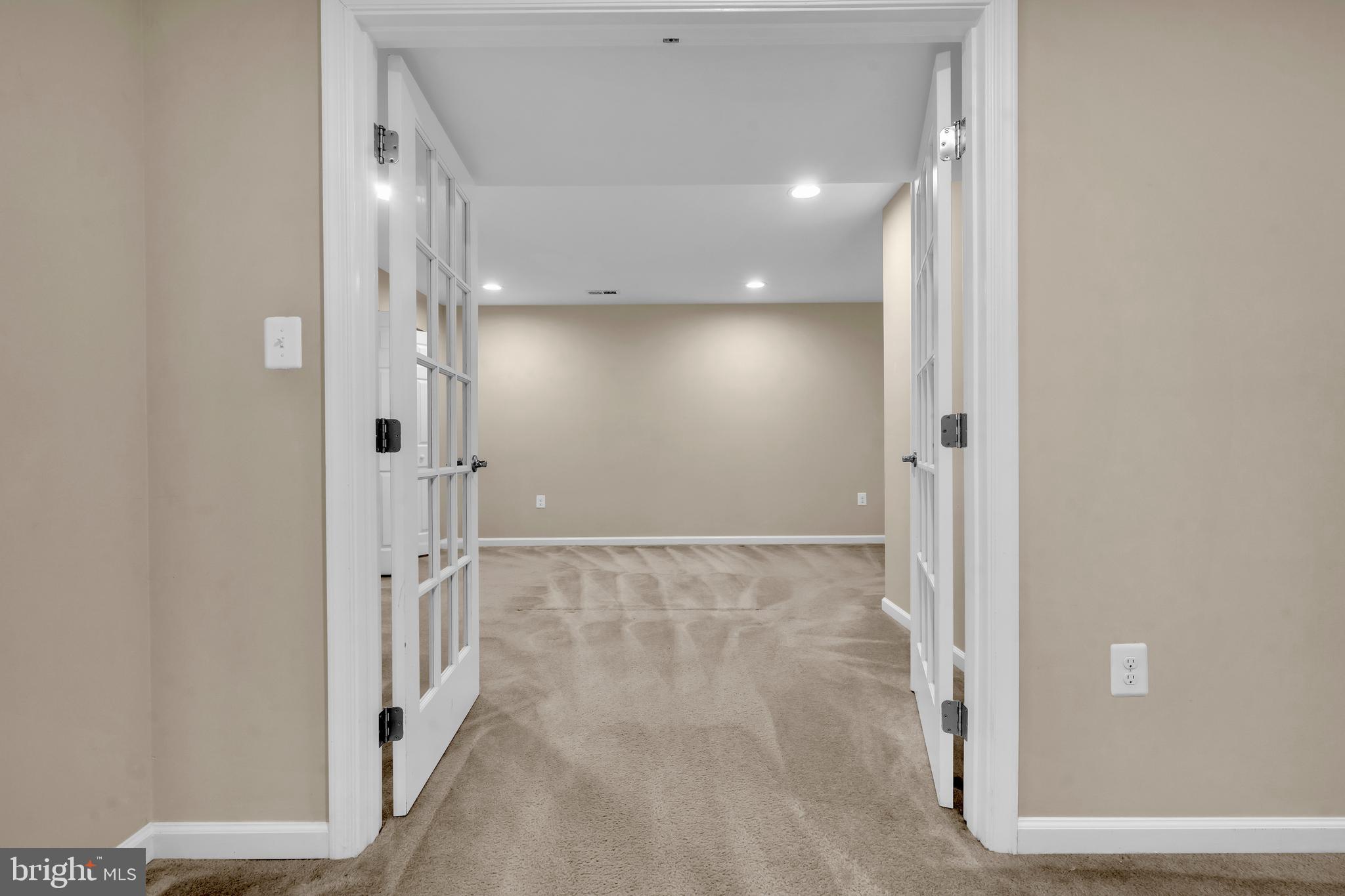 41663 McMonagle Square Aldie, VA 20105 - Photo 8 of 50 a view of a hallway with wooden floor and staircase