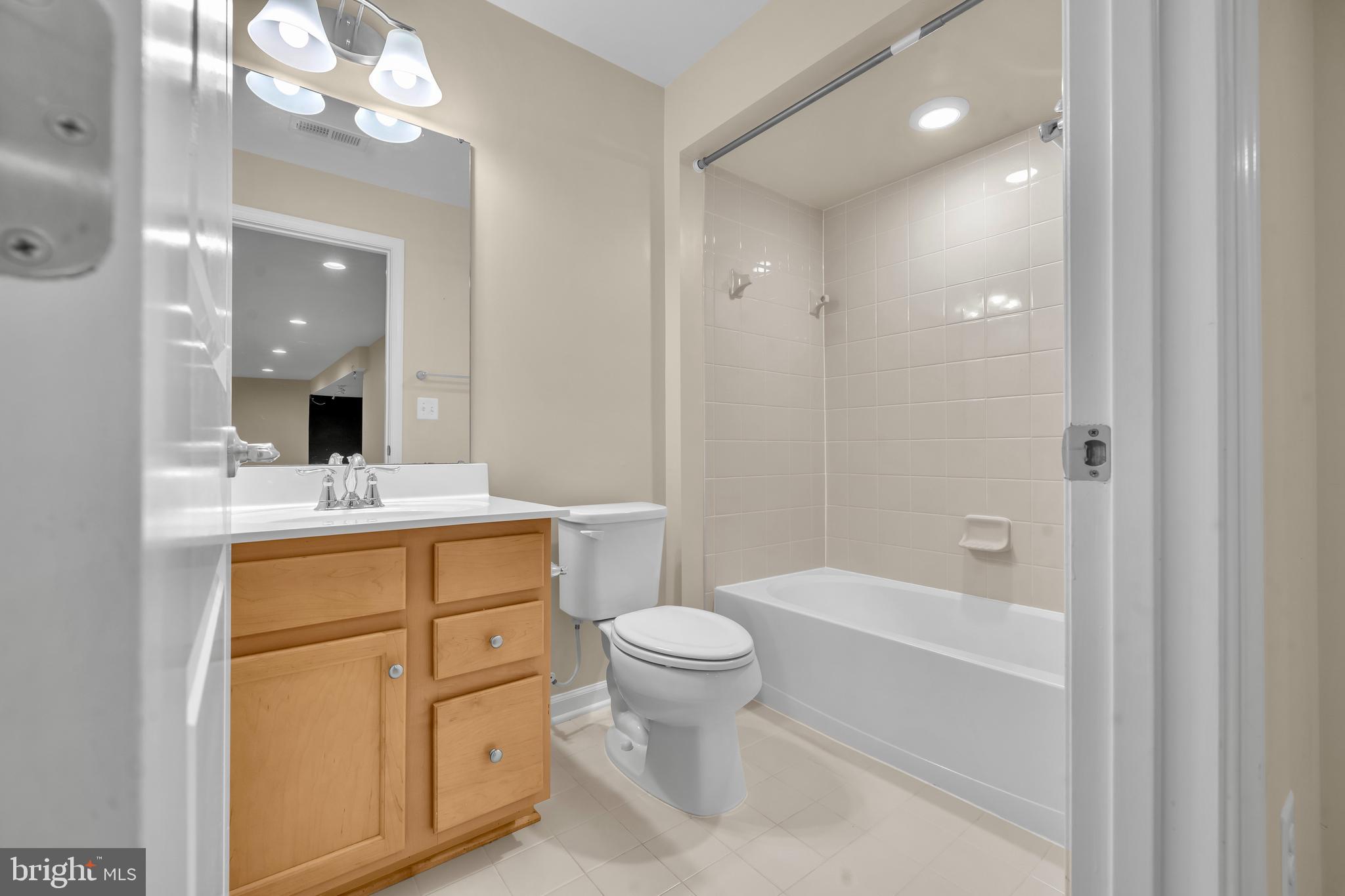 41663 McMonagle Square Aldie, VA 20105 - Photo 10 of 50 a bathroom with a sink a toilet and a mirror