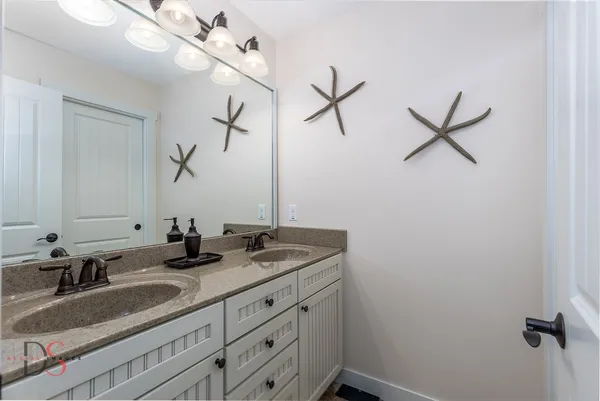 a bathroom with a sink and mirror