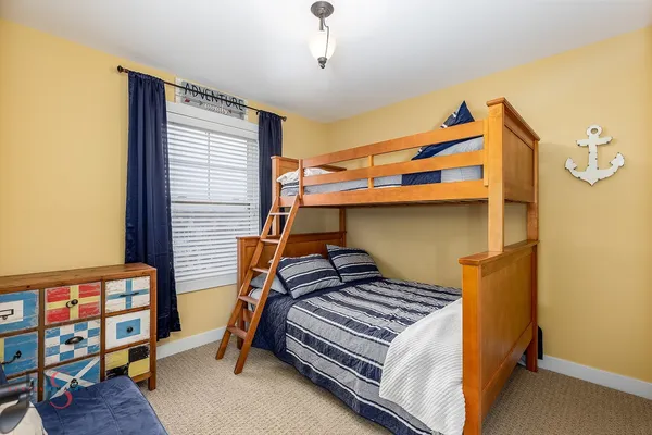 a bedroom with bunk bed