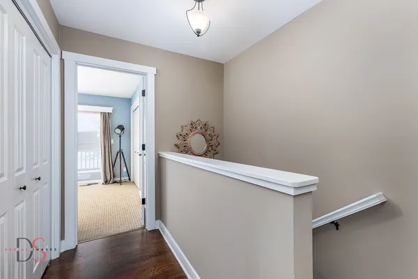 a view of hallway with wooden floor