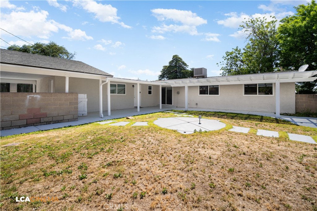 3113 Occidental Street Bakersfield, CA 93305 - Photo 19 of 19 a view of a house with pool and a yard