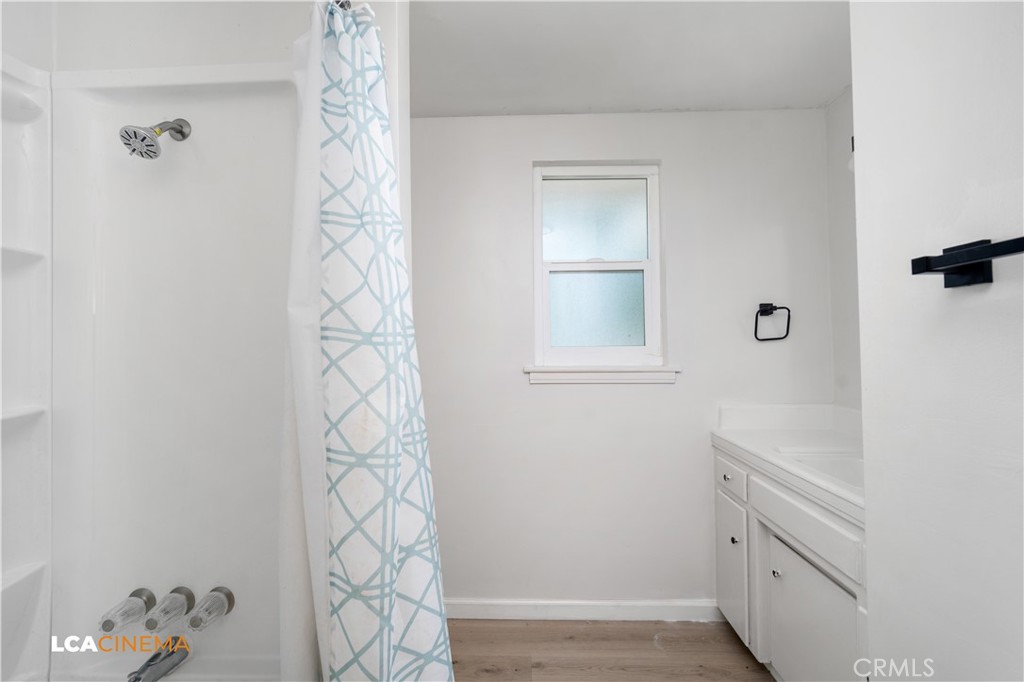 3113 Occidental Street Bakersfield, CA 93305 - Photo 6 of 19 a bathroom with a sink a toilet and shower