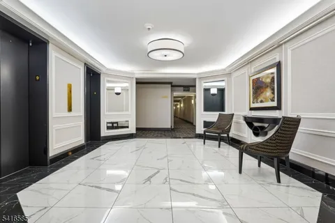 a living room with furniture a piano and a window