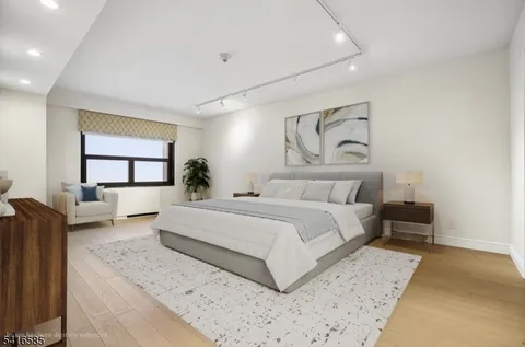 a spacious bedroom with a large bed and a window