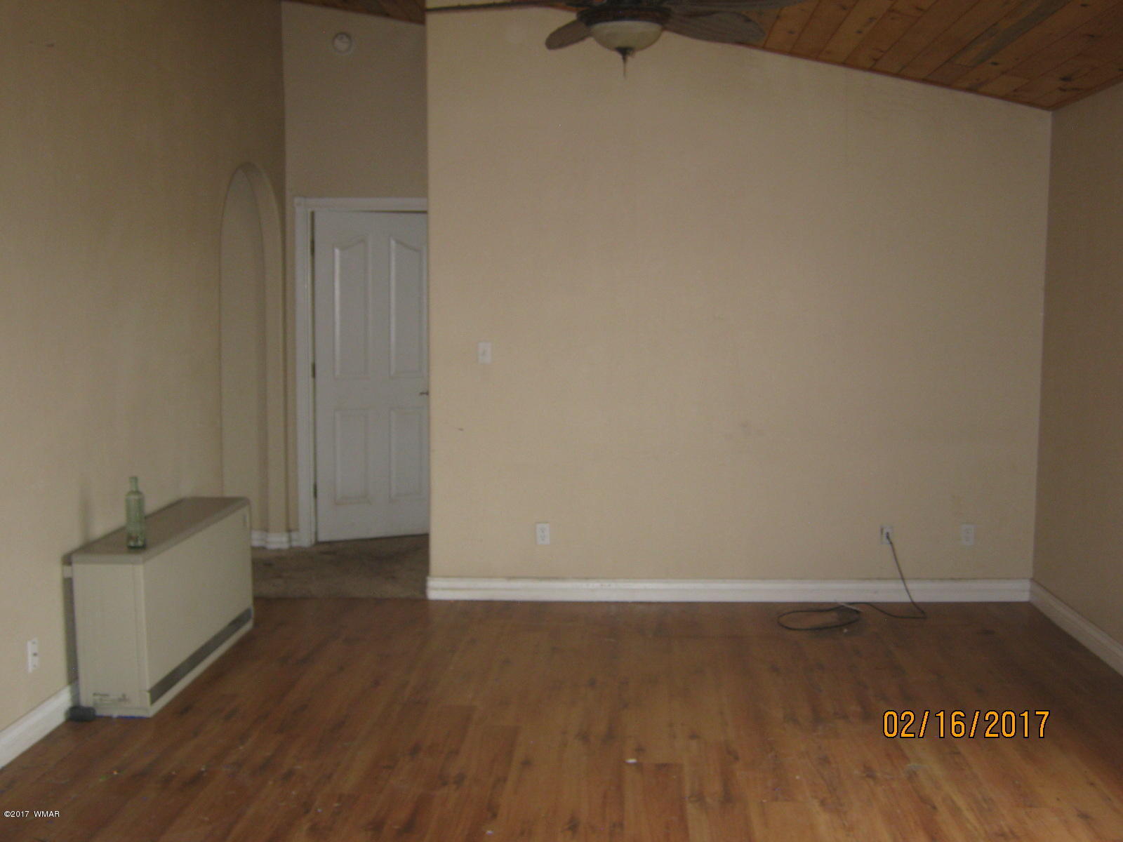 438 North Butler Street Eagar, AZ 85925 - Photo 7 of 8 a view of an empty room and wooden floor