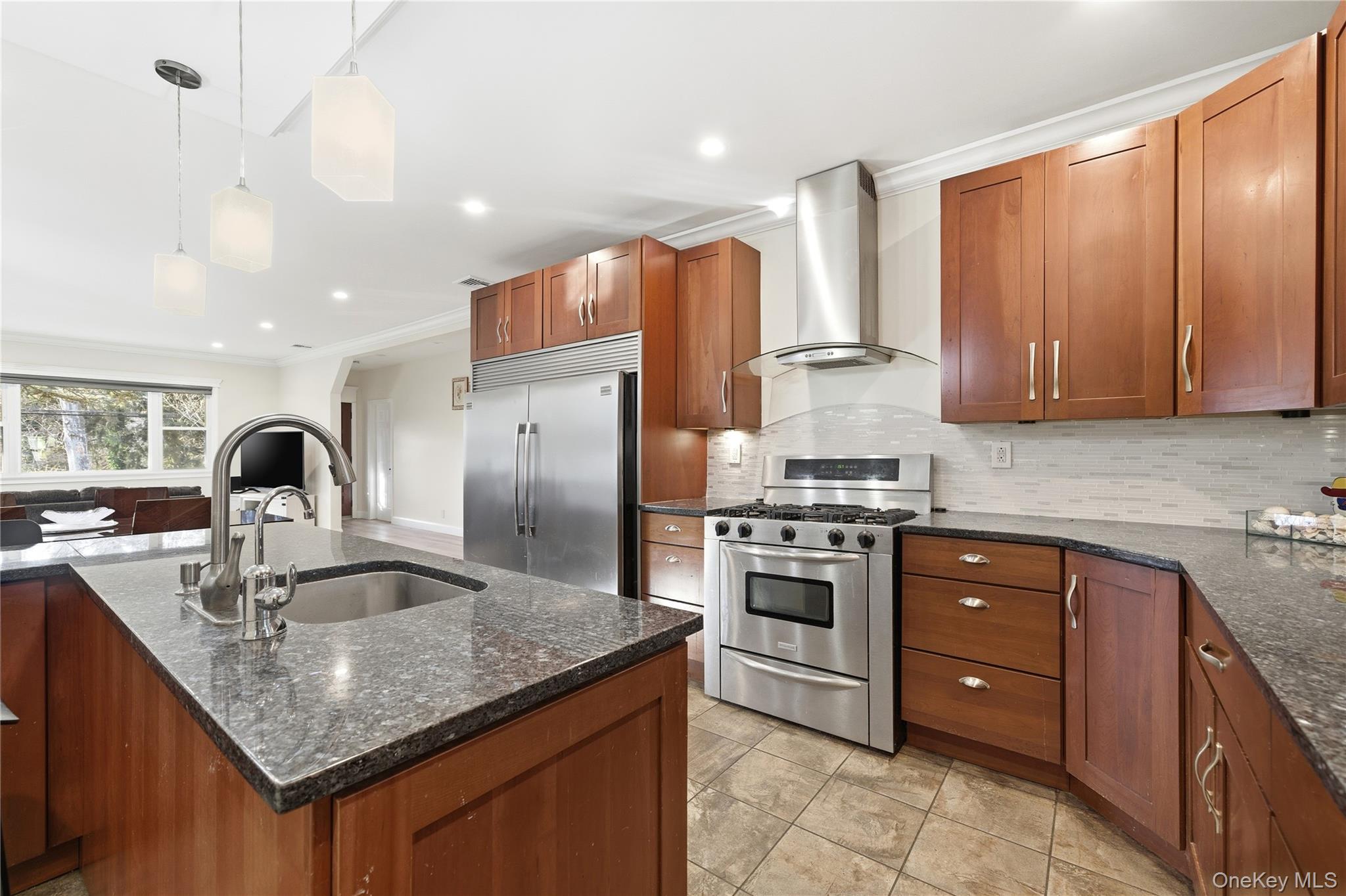 200 North Side Road Wading River, NY 11792 - Photo 12 of 30 a kitchen with stainless steel appliances granite countertop a sink stove and refrigerator