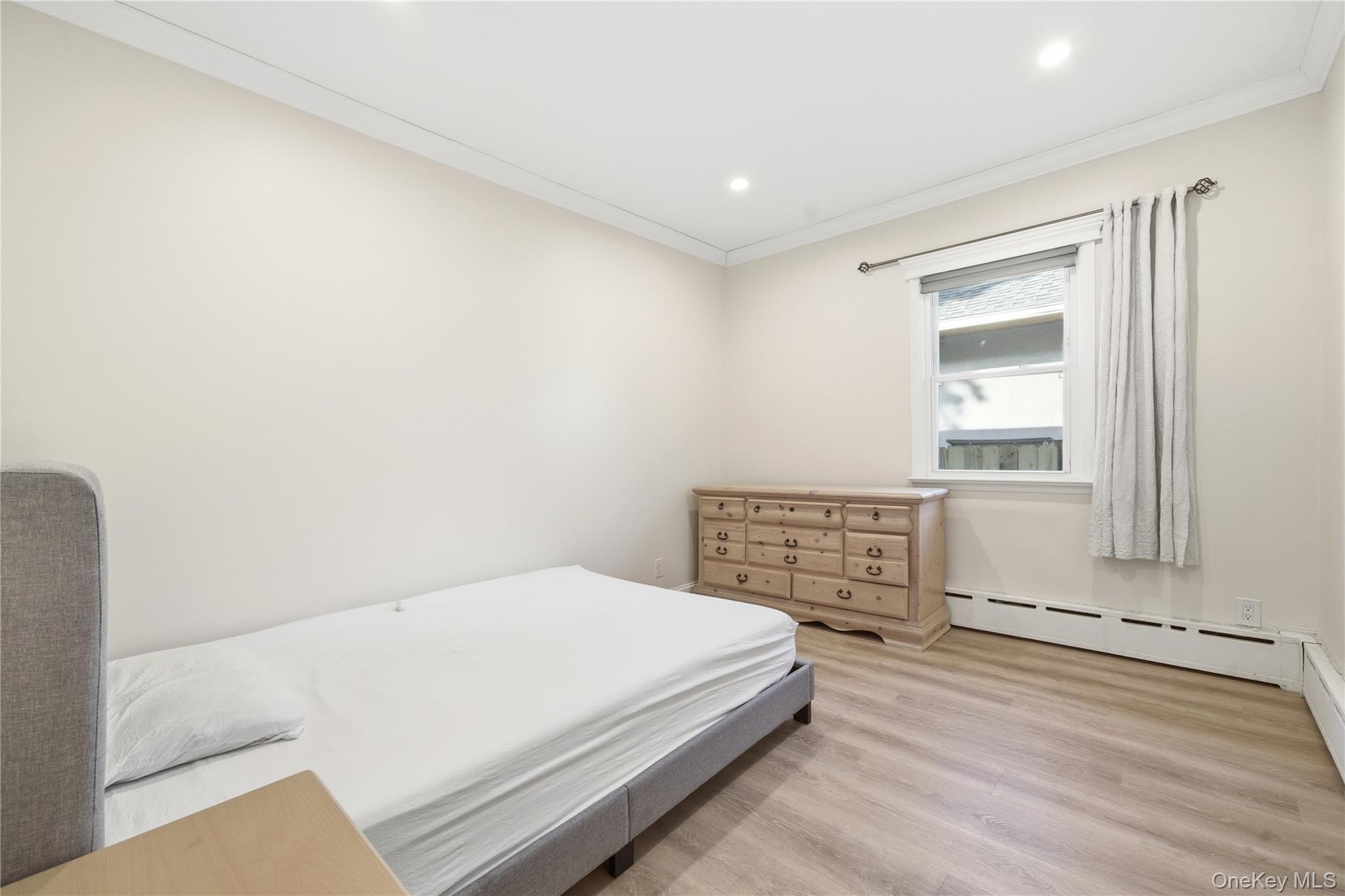 200 North Side Road Wading River, NY 11792 - Photo 13 of 30 a bedroom with a bed and a window