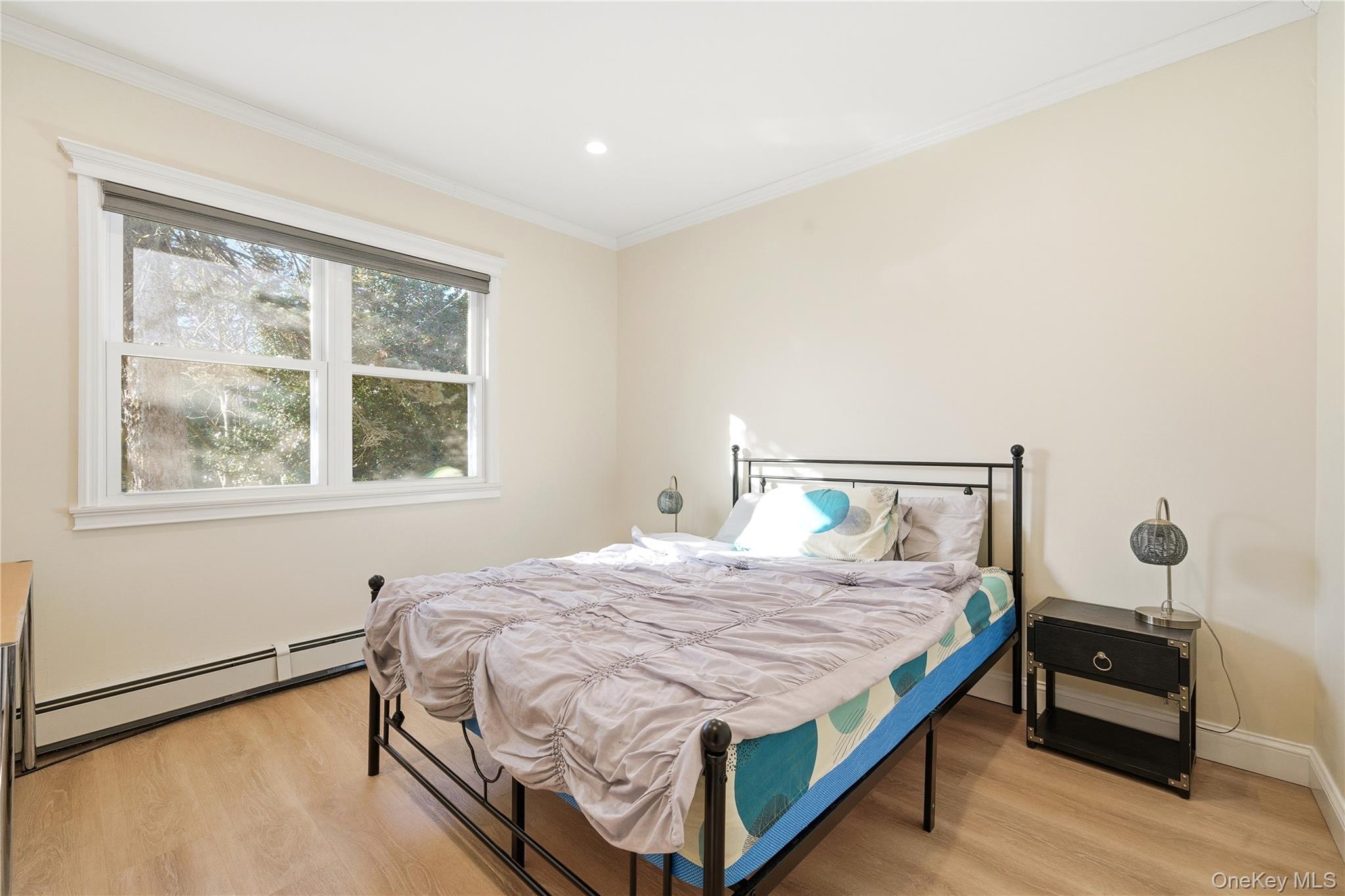 200 North Side Road Wading River, NY 11792 - Photo 14 of 30 a bedroom with a bed and a window