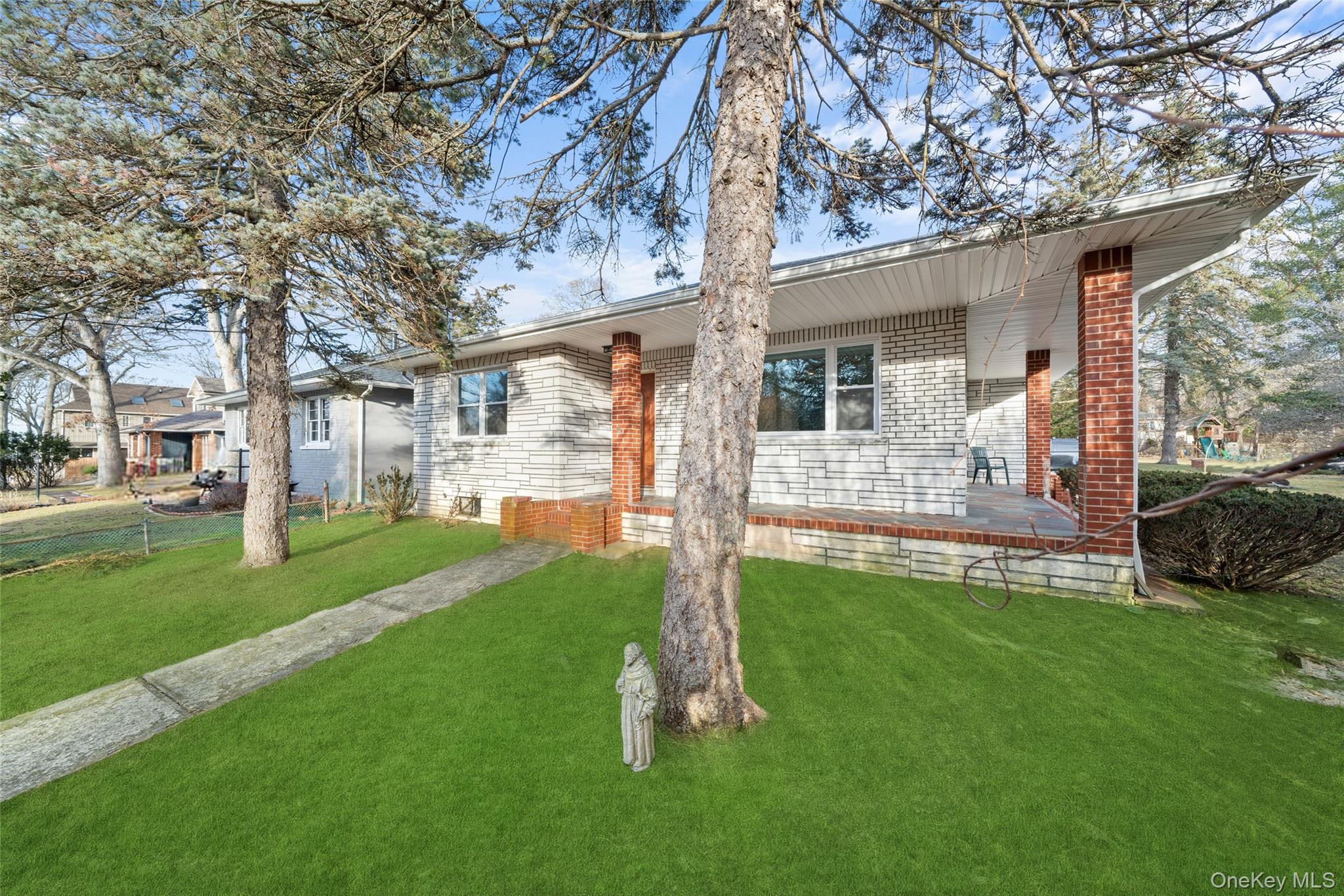 200 North Side Road Wading River, NY 11792 - Photo 2 of 30 a front view of a house with a yard