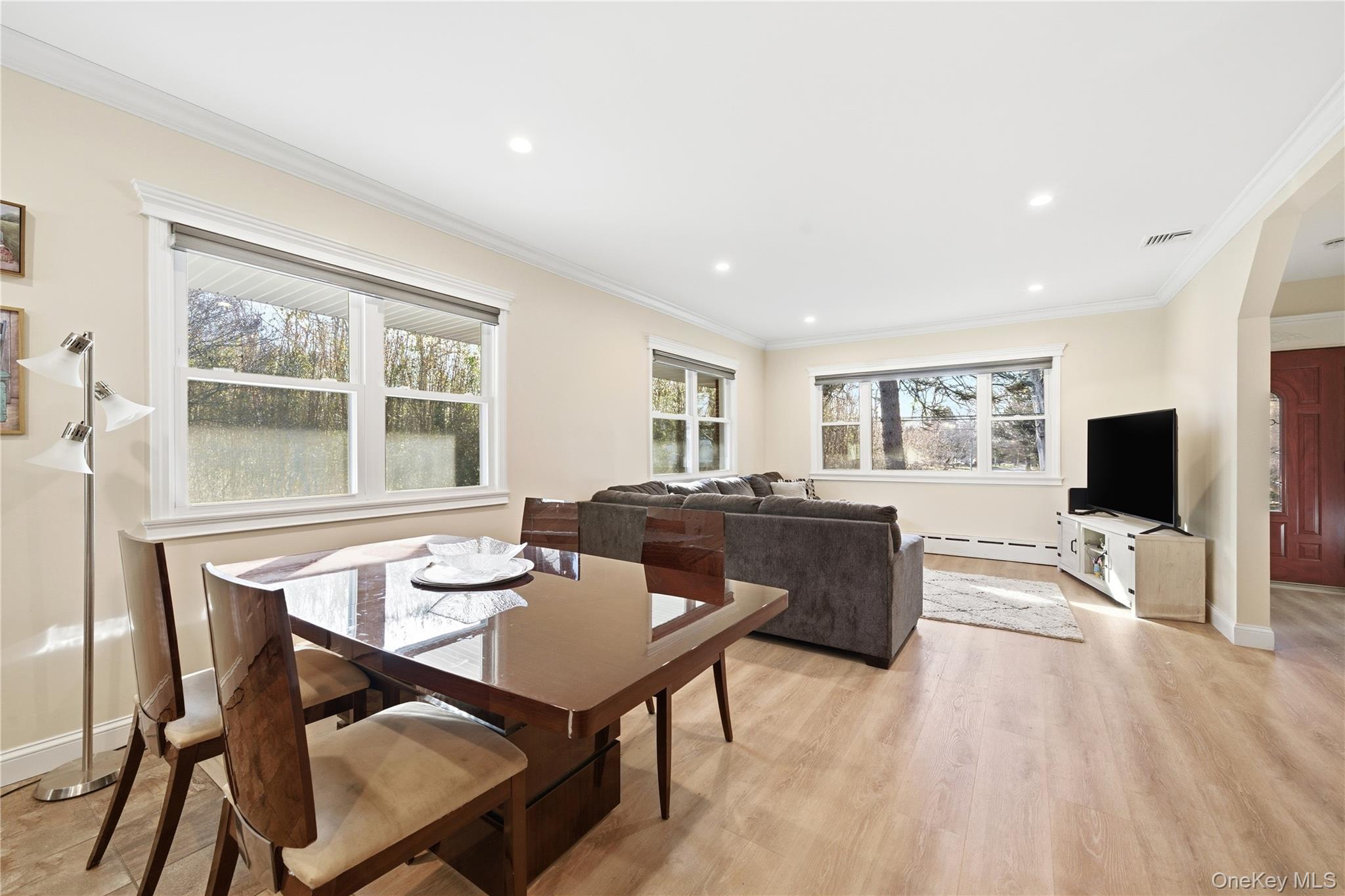 200 North Side Road Wading River, NY 11792 - Photo 5 of 30 a living room with furniture a flat screen tv and a large window