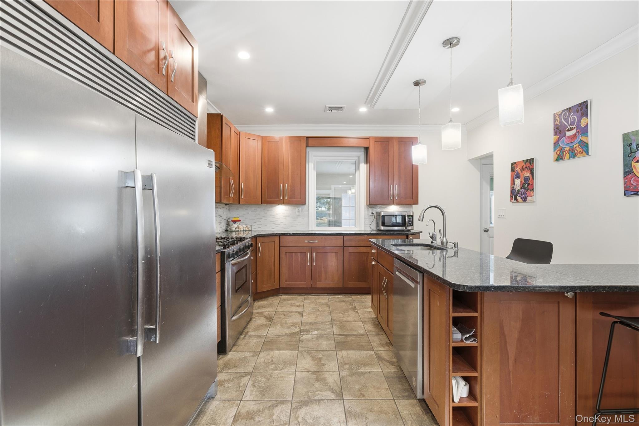 200 North Side Road Wading River, NY 11792 - Photo 8 of 30 a kitchen with stainless steel appliances granite countertop a sink stove and refrigerator