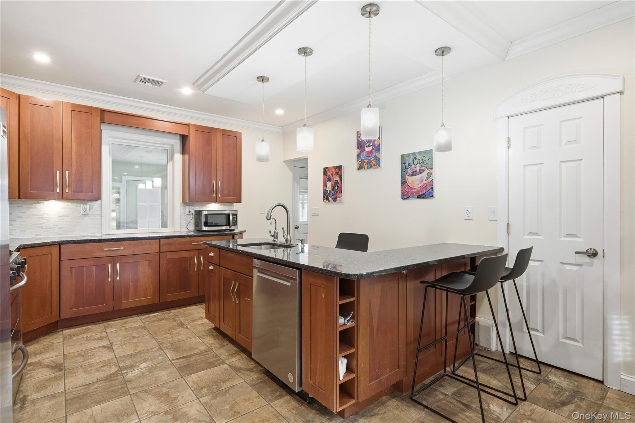 200 North Side Road Wading River, NY 11792 - Photo 9 of 30 a kitchen with stainless steel appliances granite countertop a sink and cabinets