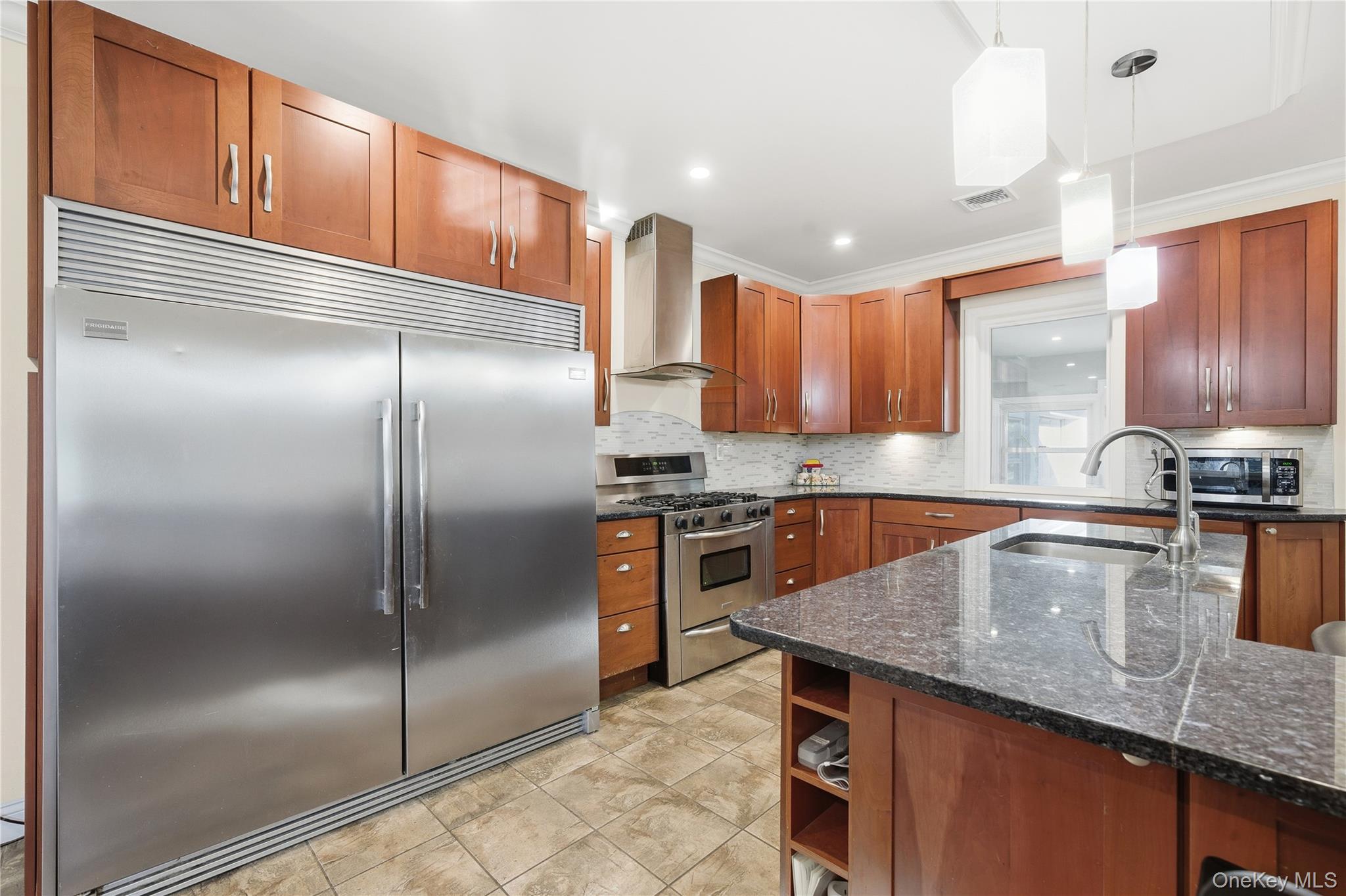 200 North Side Road Wading River, NY 11792 - Photo 10 of 30 a kitchen with stainless steel appliances granite countertop a refrigerator a sink and a stove
