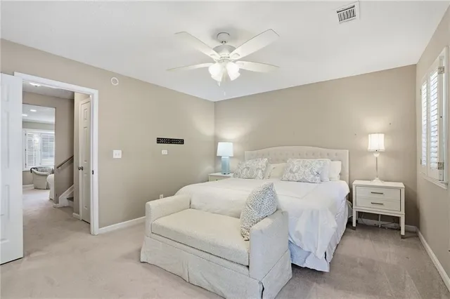 a bed room with a bed and a chandelier