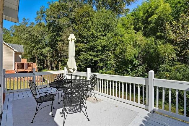 a view of a patio with a table and chairs