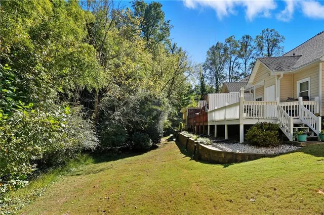 a view of swimming pool with outdoor seating and plants