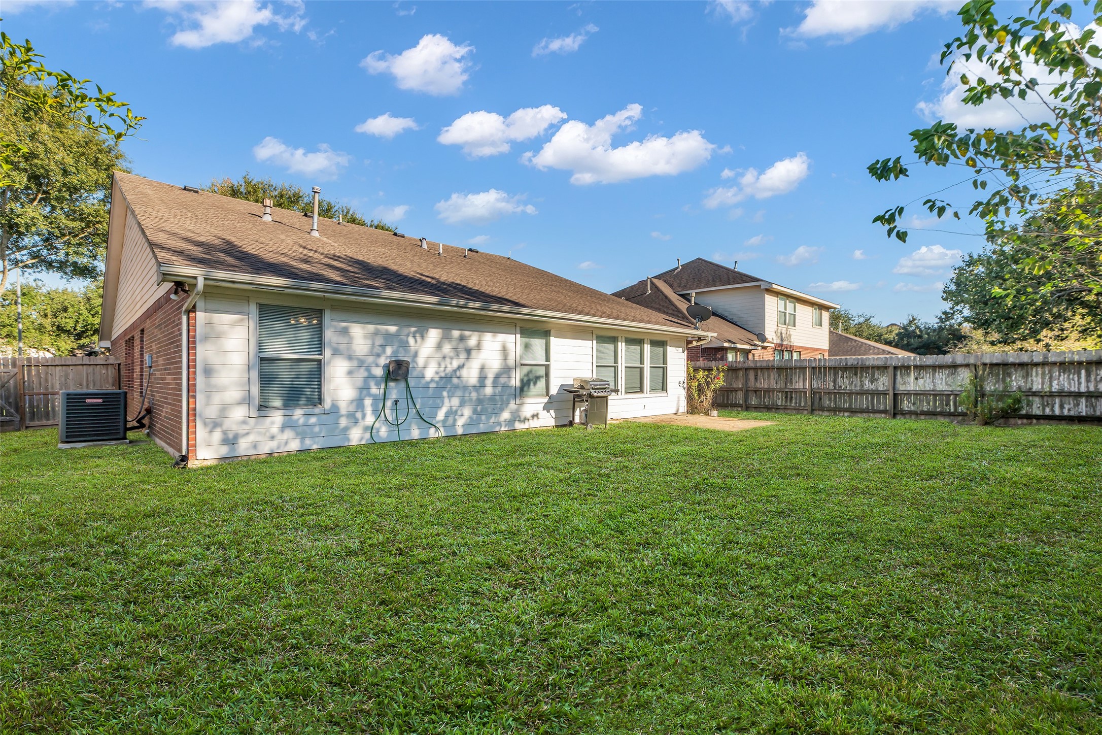 3326 Pebble Beach Lane Pearland, TX 77584 - Photo 26 of 32 Great sized backyard to enjoy quality time with family and friends.