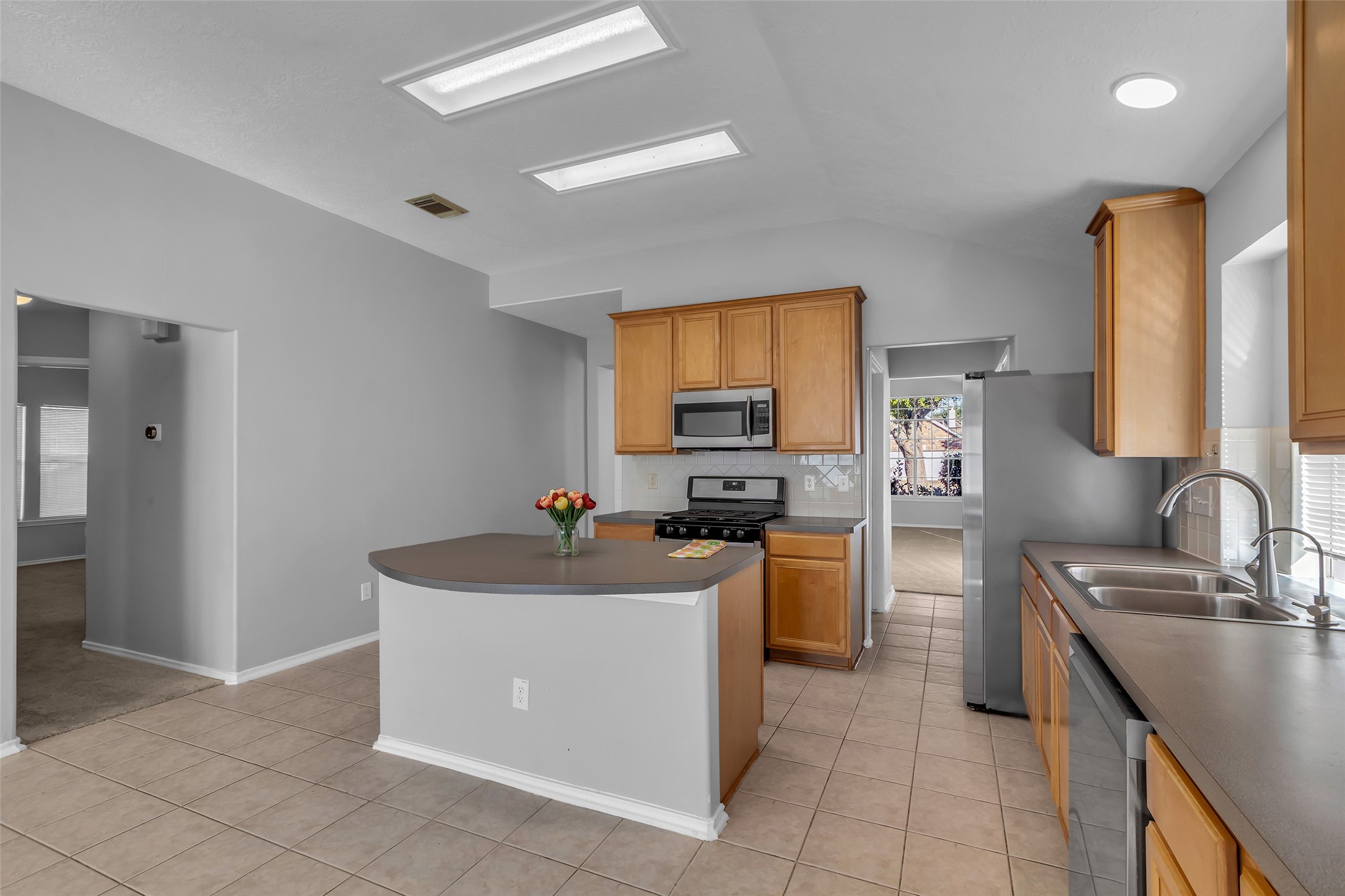 3326 Pebble Beach Lane Pearland, TX 77584 - Photo 31 of 32 This spacious open floorplan features formal living/dining combo, open kitchen/breakfast/den area with big island!