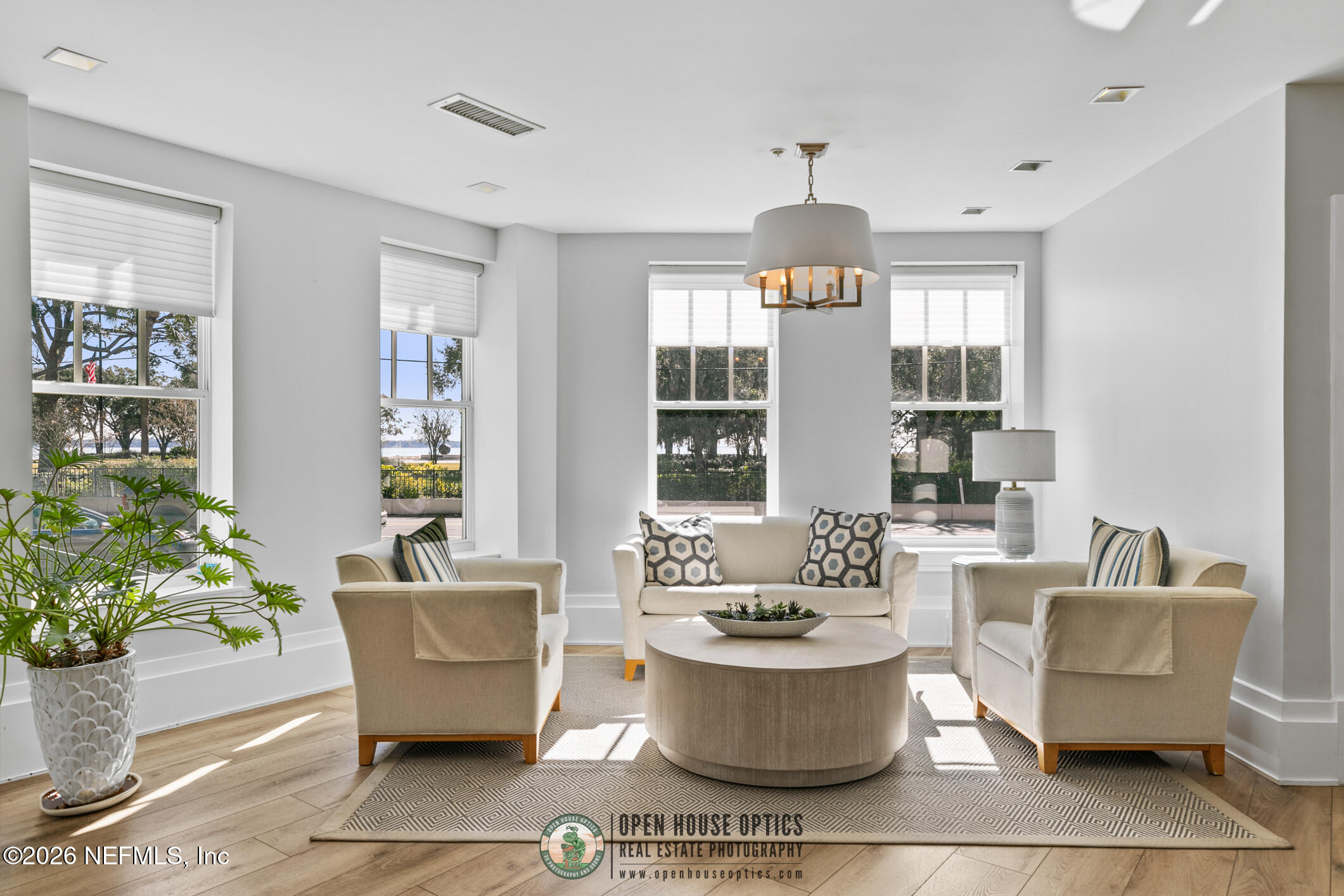 1661 Riverside Avenue, Unit 407 Jacksonville, FL 32204 - Photo 32 of 60 a living room with furniture and a chandelier