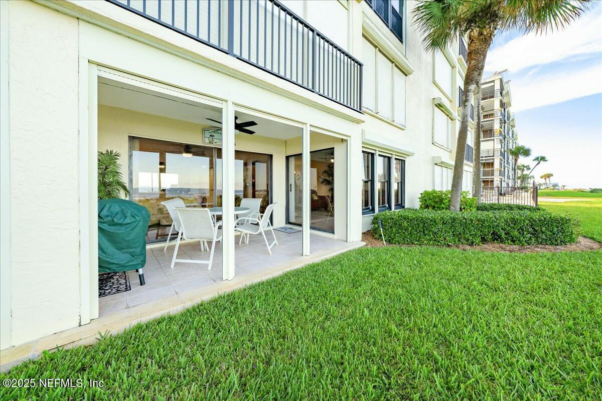 8090 Florida A1A, Unit 102 St. Augustine, FL 32080 - Photo 27 of 49 a view of a house with a backyard