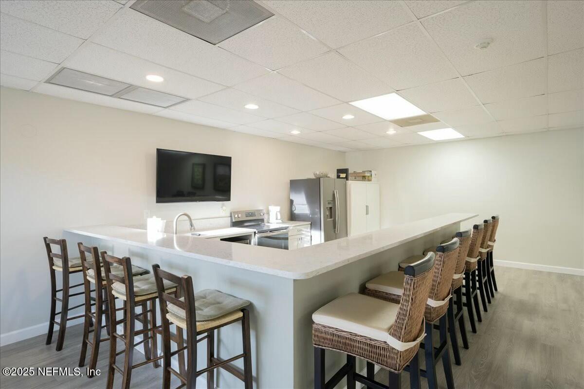 8090 Florida A1A, Unit 102 St. Augustine, FL 32080 - Photo 31 of 49 a view of a dining room with furniture