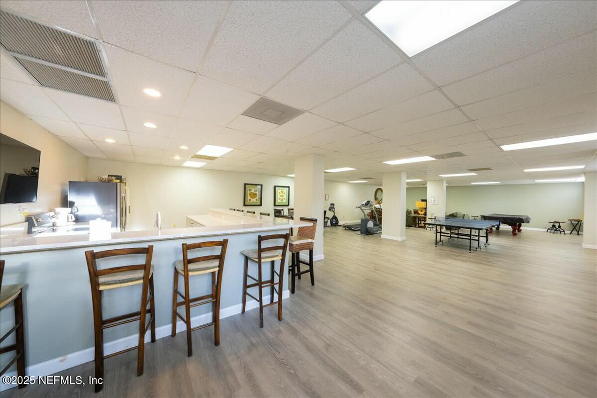 8090 Florida A1A, Unit 102 St. Augustine, FL 32080 - Photo 32 of 49 a kitchen with lots of counter space and furniture