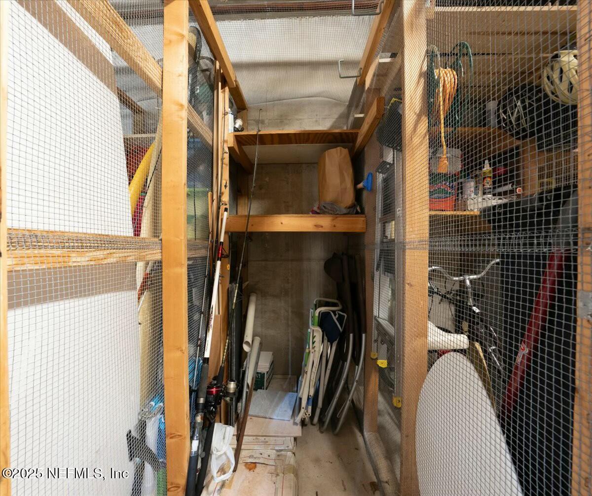8090 Florida A1A, Unit 102 St. Augustine, FL 32080 - Photo 38 of 49 a view of walk in closet with clothes