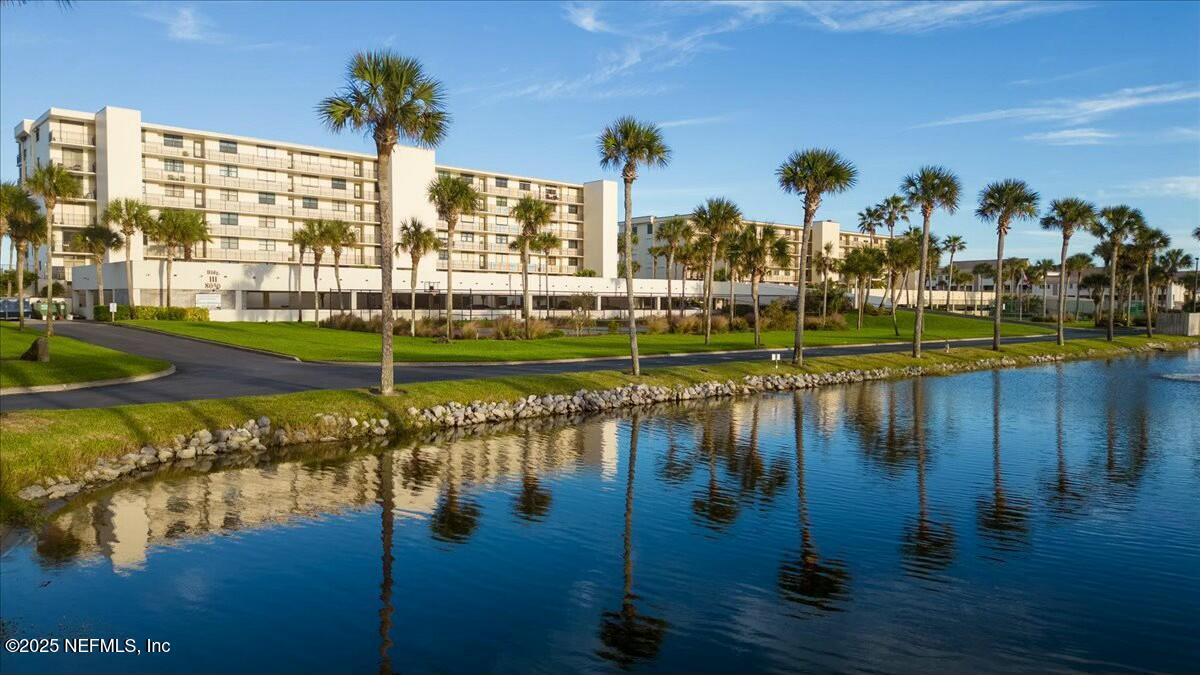 8090 Florida A1A, Unit 102 St. Augustine, FL 32080 - Photo 41 of 49 a view of a lake with a big yard