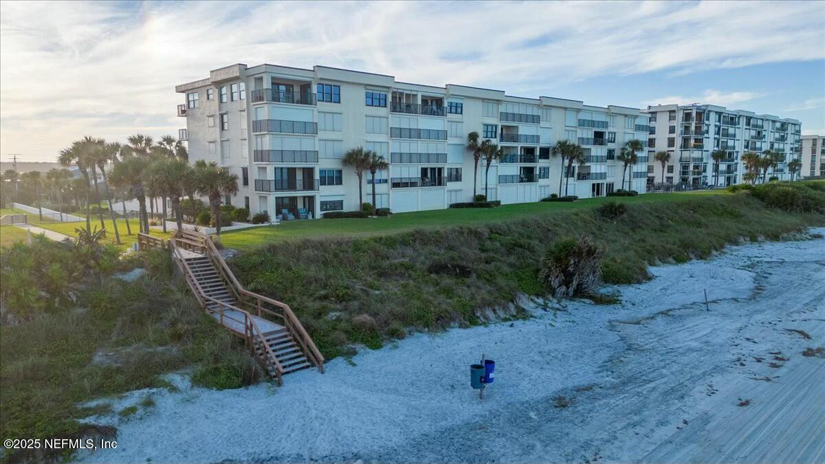 8090 Florida A1A, Unit 102 St. Augustine, FL 32080 - Photo 48 of 49 a view of a big yard next to a building