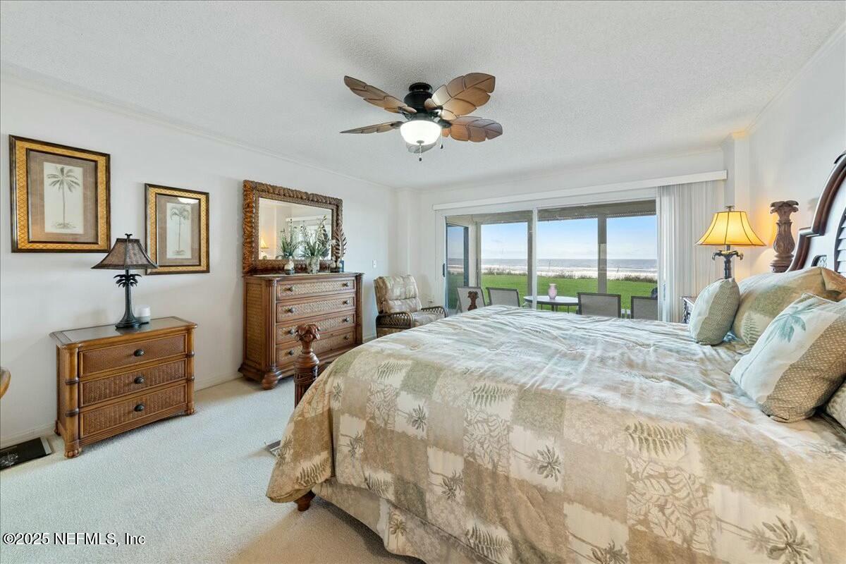 8090 Florida A1A, Unit 102 St. Augustine, FL 32080 - Photo 9 of 49 a bedroom with a bed and window
