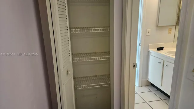 a en suite bathroom with a sink and mirror