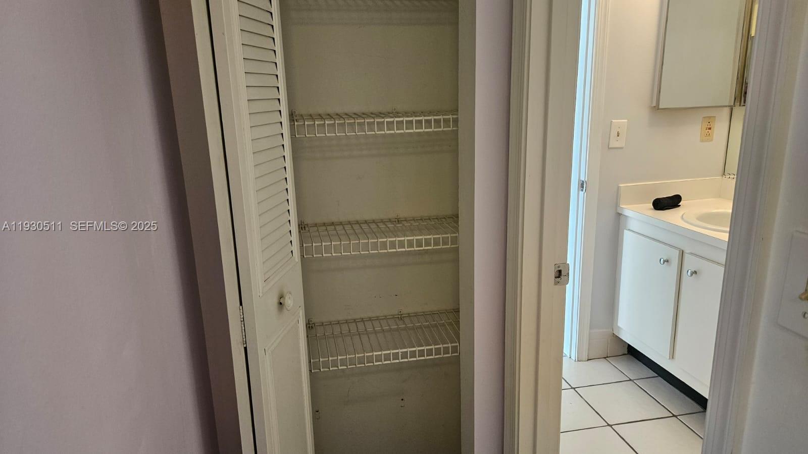 a en suite bathroom with a sink and mirror