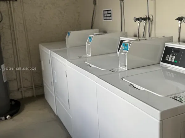 a bathroom with a sink and a washing machine