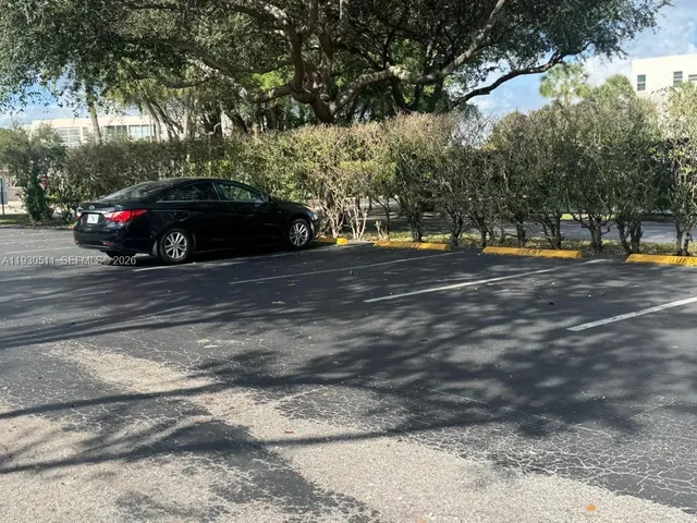 a view of street with parked cars