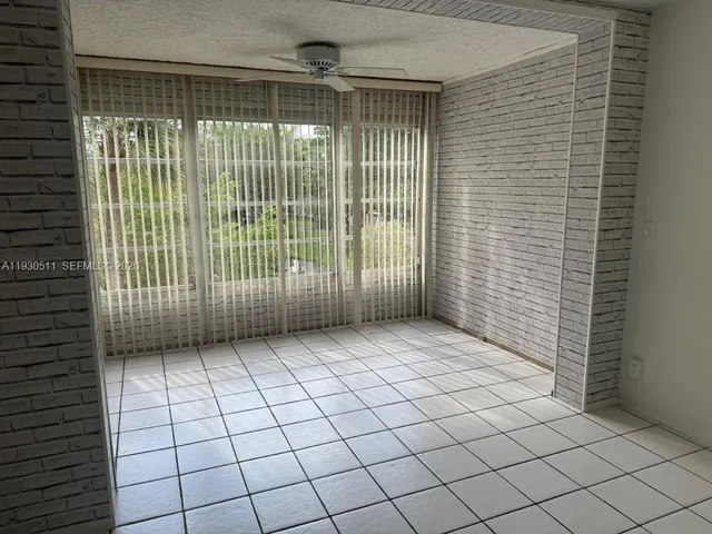 a view of a livingroom with a large window