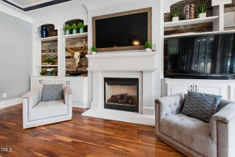 a kitchen with stainless steel appliances granite countertop a sink and wooden cabinets