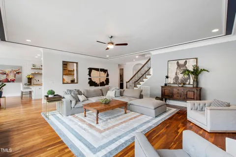 a living room with furniture and a floor to ceiling window