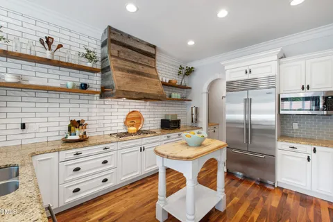 a view of a livingroom with furniture and wooden floor