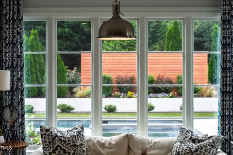 a view of a livingroom with furniture and hardwood floor