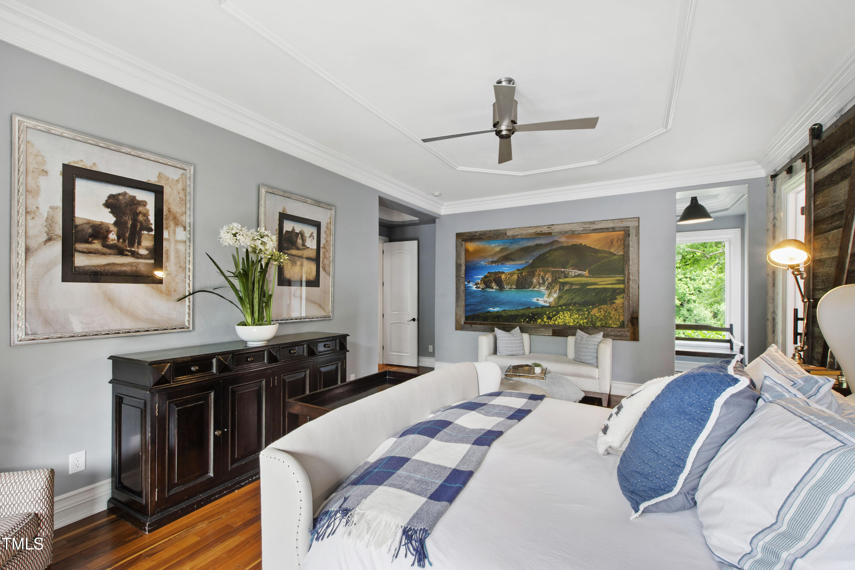 4725 Saratoga Falls Lane Raleigh, NC 27614 - Photo 37 of 97 a living room with furniture a large window and a flat screen tv