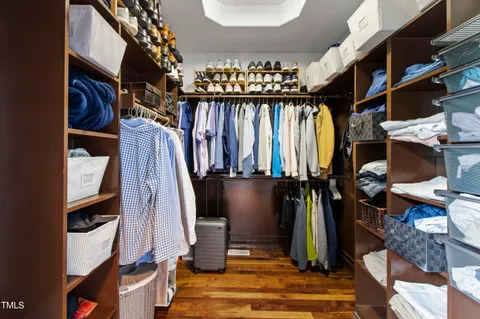 an aerial view of a swimming pool with outdoor seating and yard