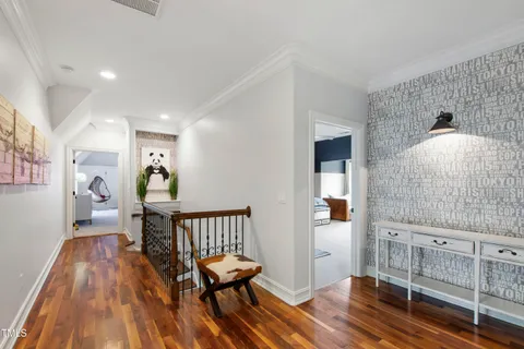 a house with a lot of plants in front of it