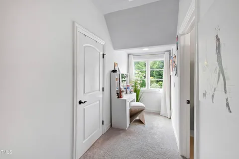 a front view of a house with a yard table and chairs